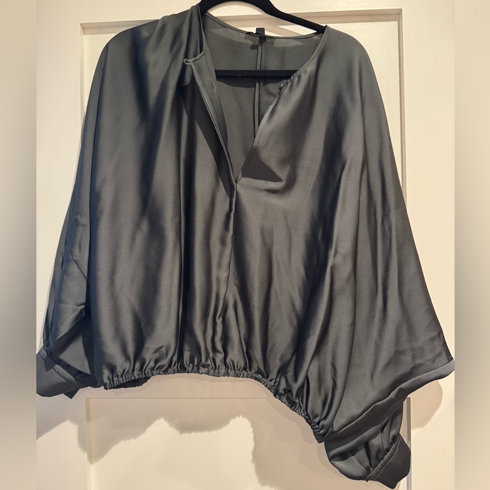 Silk. In great condition, only worn once.